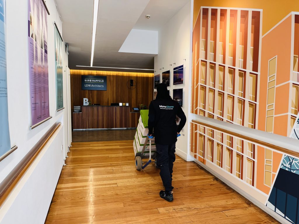 MoveStore staff moving documents in an Edinburgh office