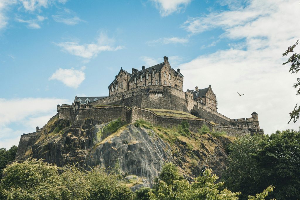 A picture looking up to Edinburgh Castle with a blue sky