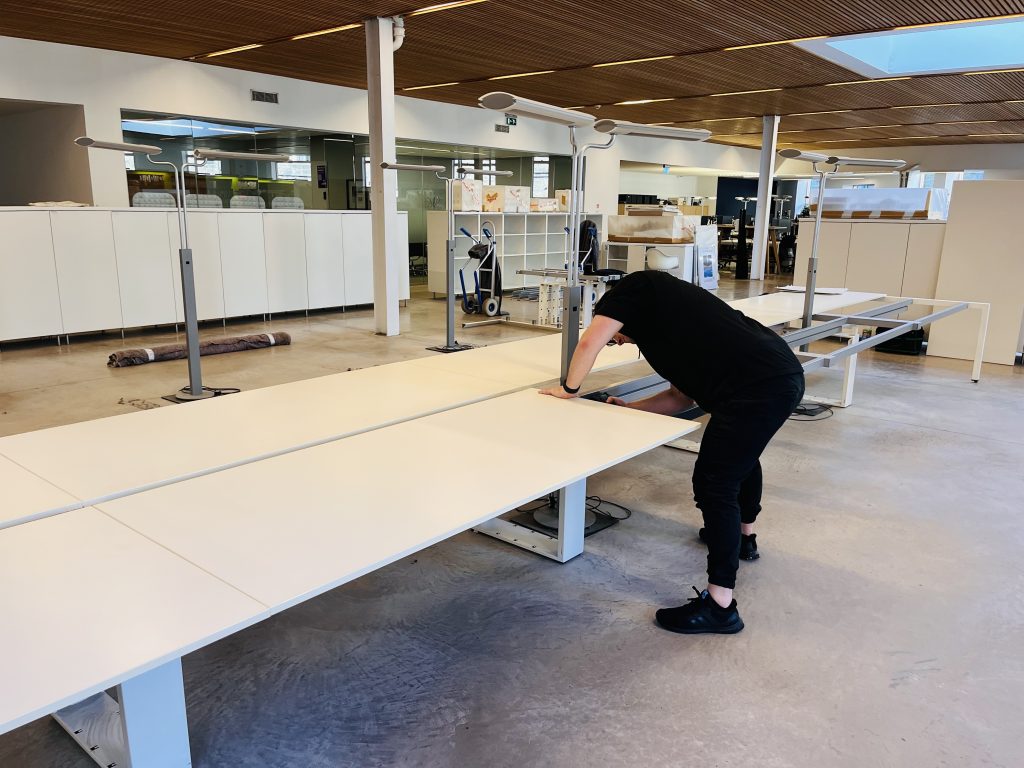 Dismantling a desk for a commercial move by MoveStore