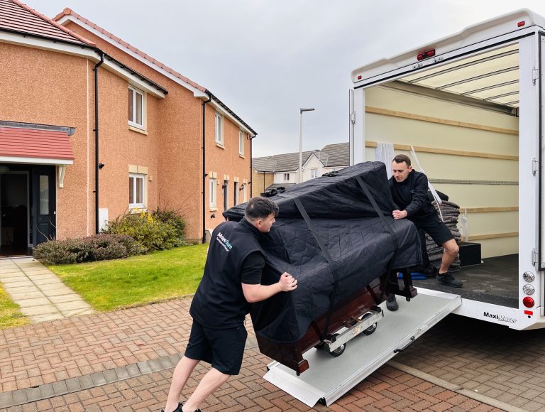 Specialist Removals. Piano being carefully moved onto a MoveStore van.