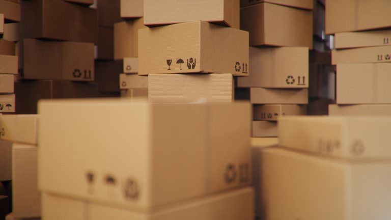Background of cardboard boxes inside warehouse, logistic centre. Warehouse filled with cardboard boxes.