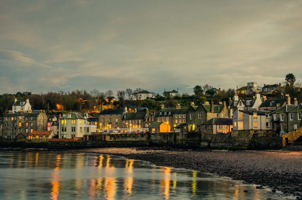 South Queensferry Removals. A view of South Queensferry from the see at dusk.