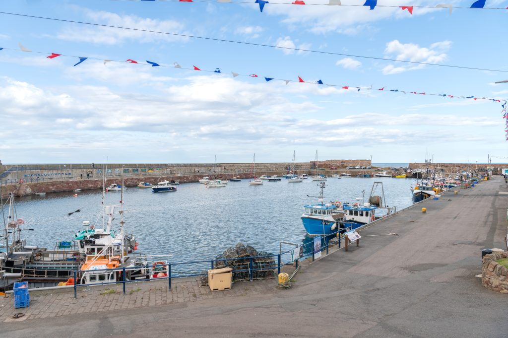 Commercial fishing and pleasure boats in Dunbar Harbour, Scotland, United Kingdom. Dunbar Removals service is provided by MoveStore Removals and Storage.