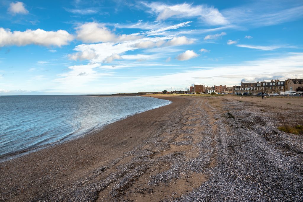 Musselburgh beach with Musselburgh in the background - a Musselburgh removals service is provided by MoveStore