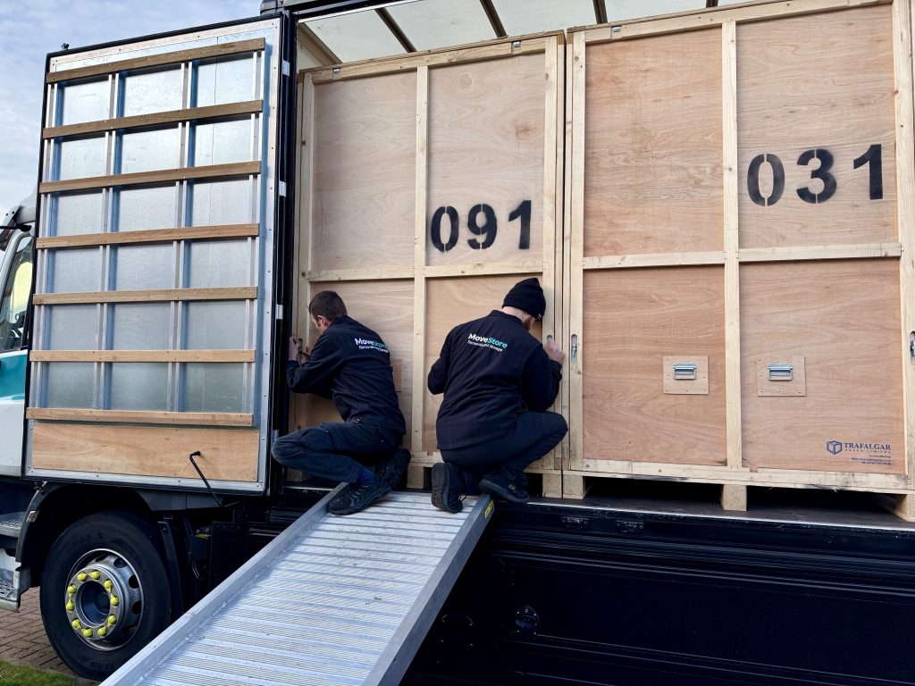 MoveStore movers securing the door of a storage container for commercial storage