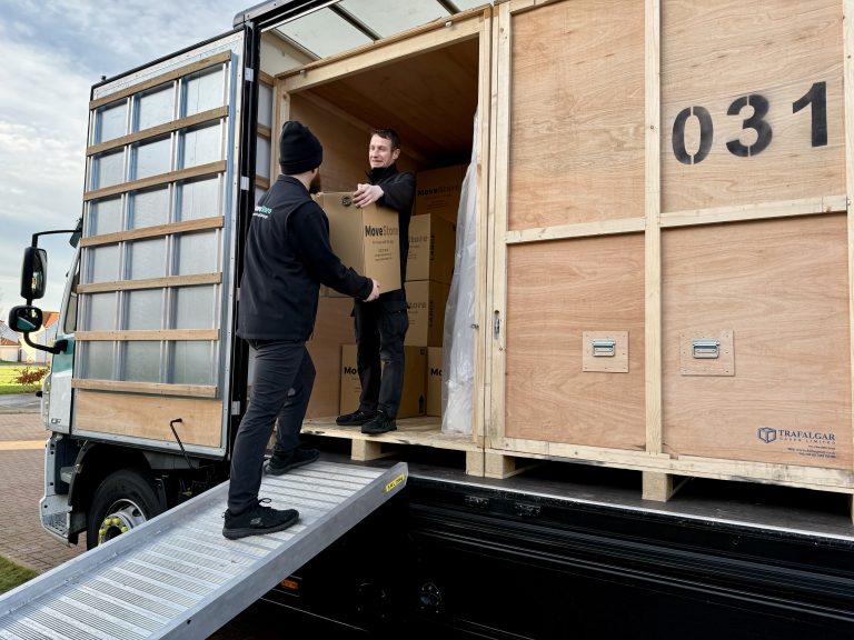 MoveStore team loading a storage container on a MoveStore lorry