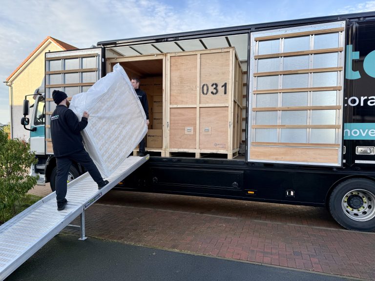 A mattress protected by a MoveStore Storage Mattress Protector being loaded onto their removals lorry